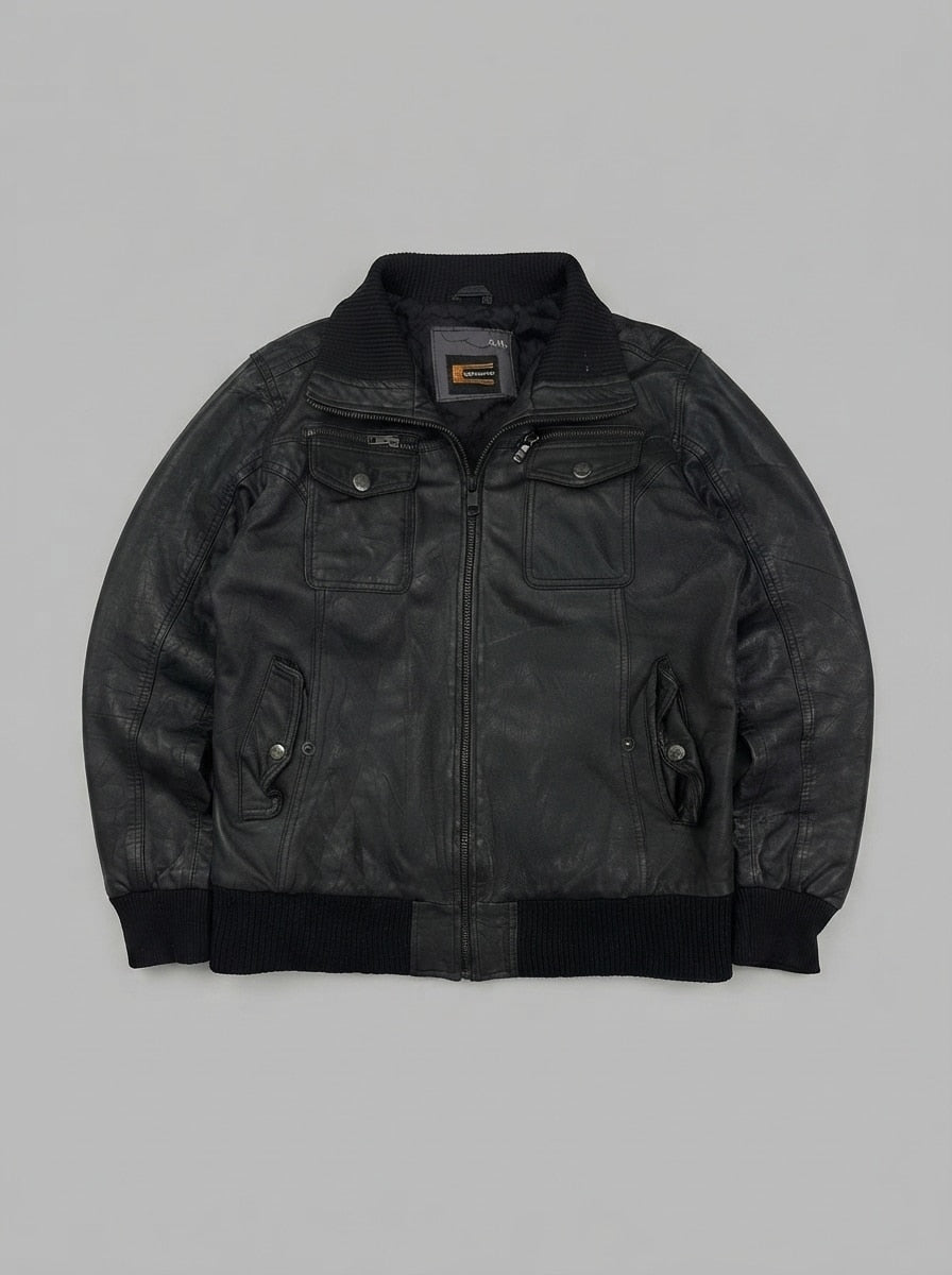 Black leather bomber jacket, size M, shown flat from the front. Chest zips and snap tabs.