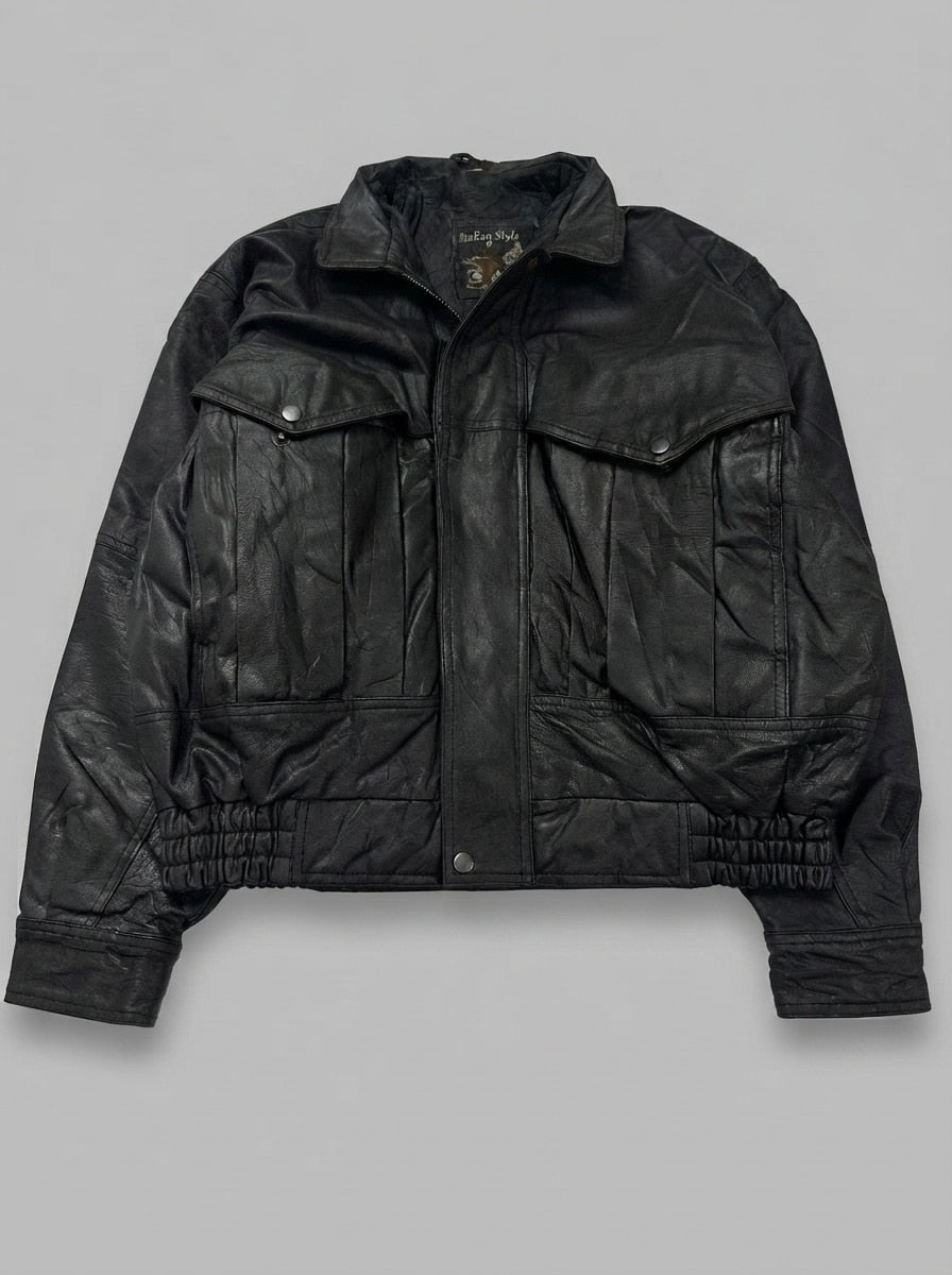 Black leather vintage jacket, size XXL, shown flat from the front. Bomber-trucker hybrid.
