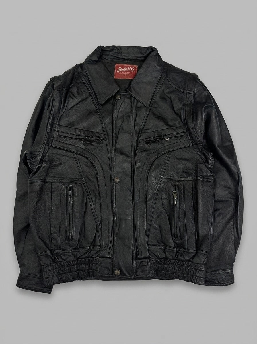 Black leather vintage jacket, size XL, shown flat from the front. Brass snap accents.
