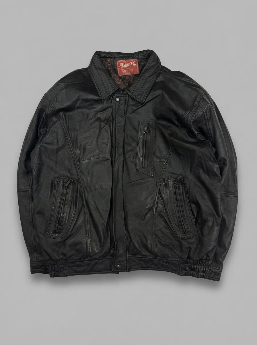 Black leather vintage jacket, size XXL, shown flat from the front. Retro multi-pocket.