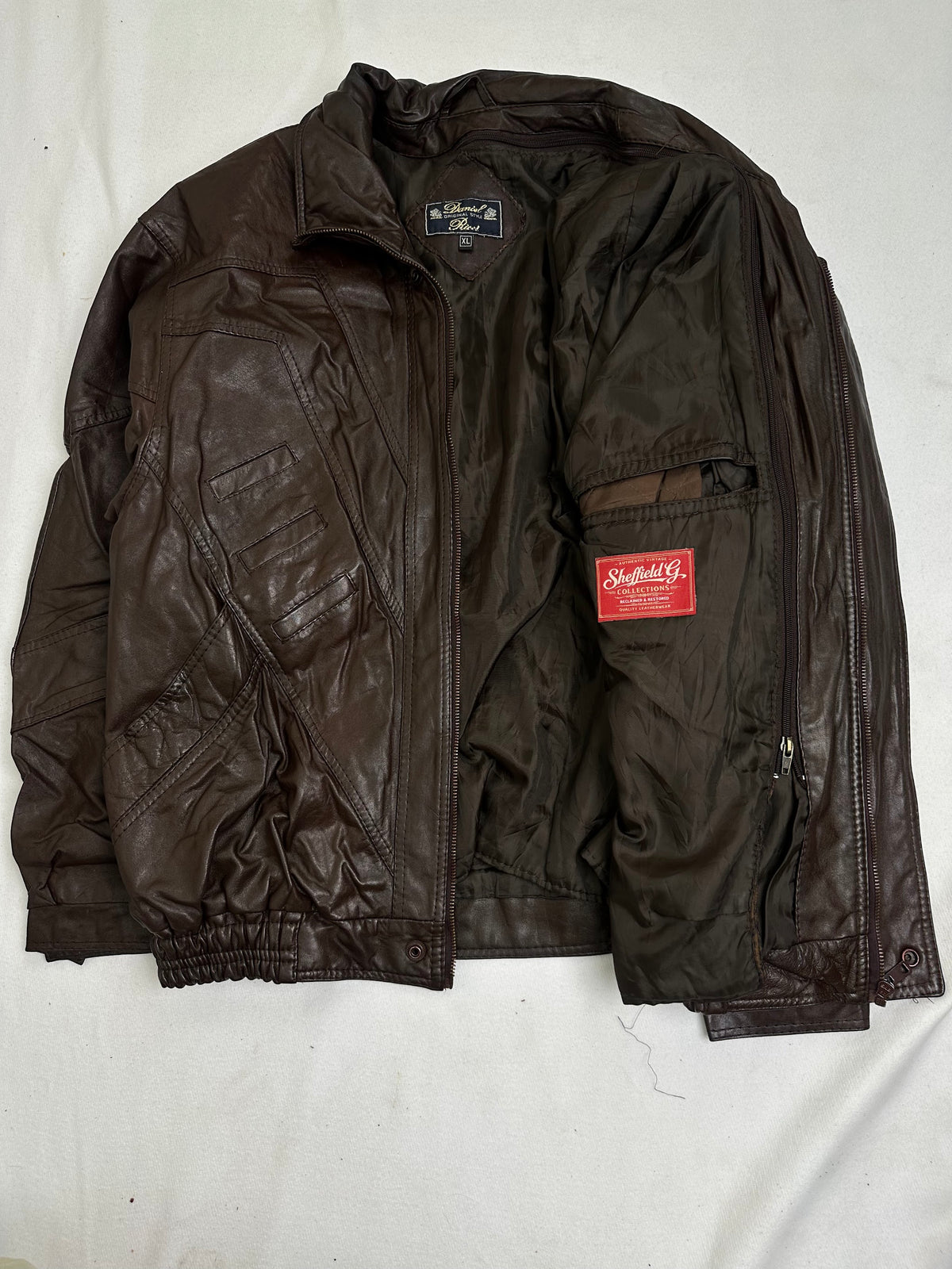 Zipped chest pocket above a slanted hand pocket