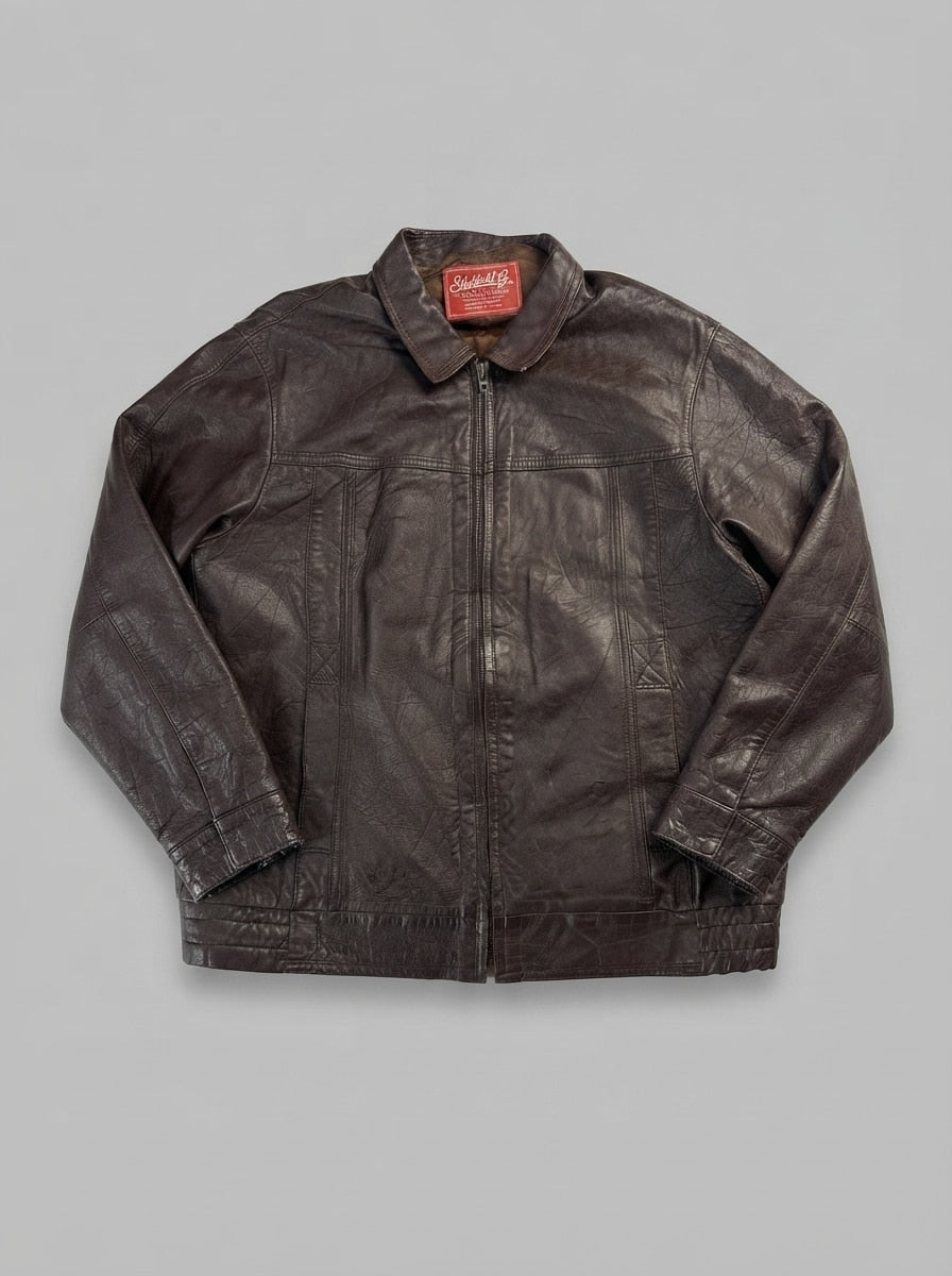 Brown leather harrington jacket, size L, shown flat from the front. Tan-lined classic.