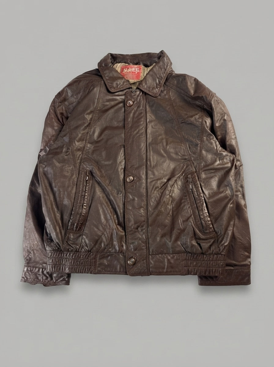 Brown leather harrington jacket, size XL, shown flat from the front. Tartan lined.