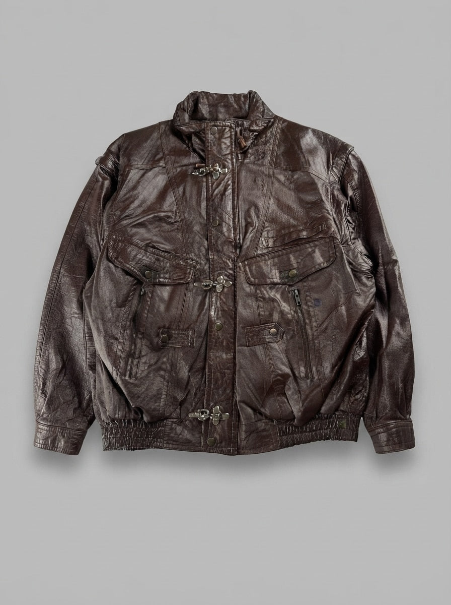 Brown leather vintage jacket, size XL, shown flat from the front. Ornate metal clasps.