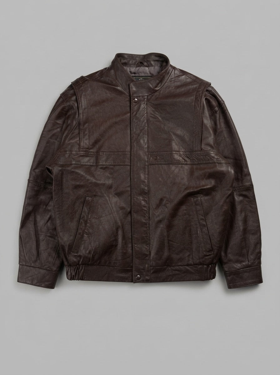 Brown leather vintage jacket, size XL, shown flat from the front. Snap-button pockets.