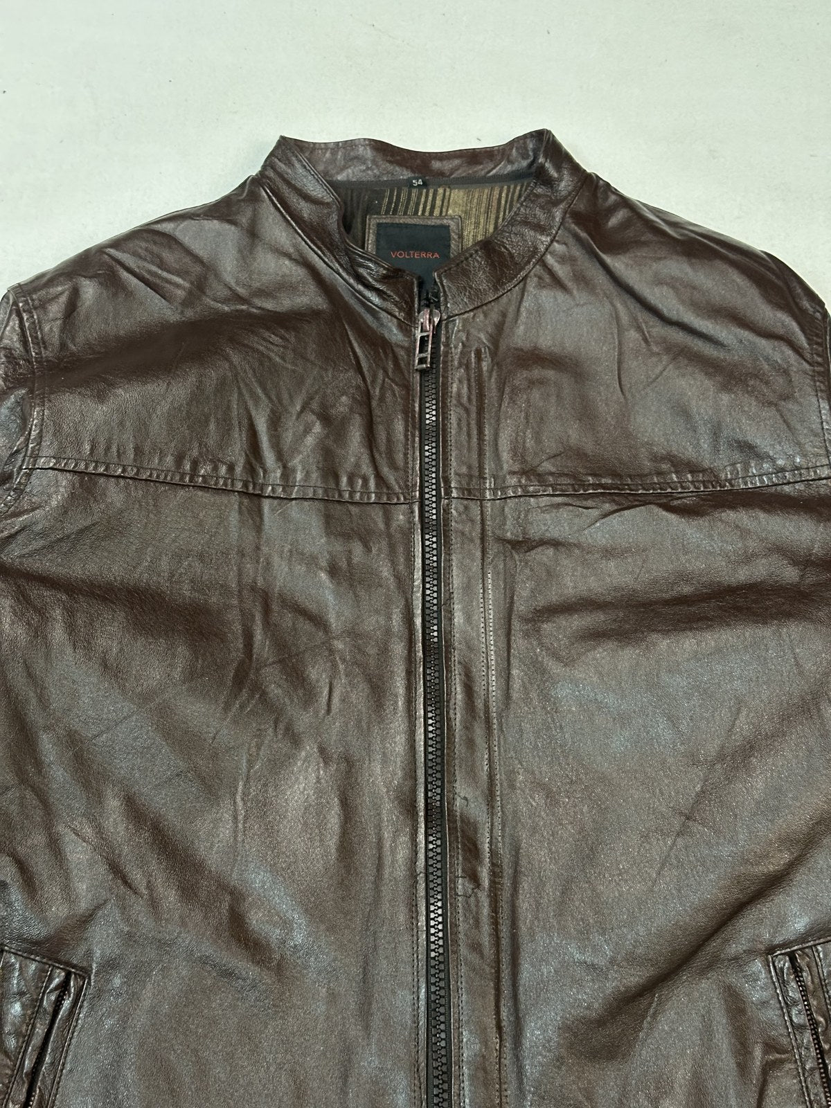 Reverse of the burgundy cafe racer jacket showing an unbroken back panel