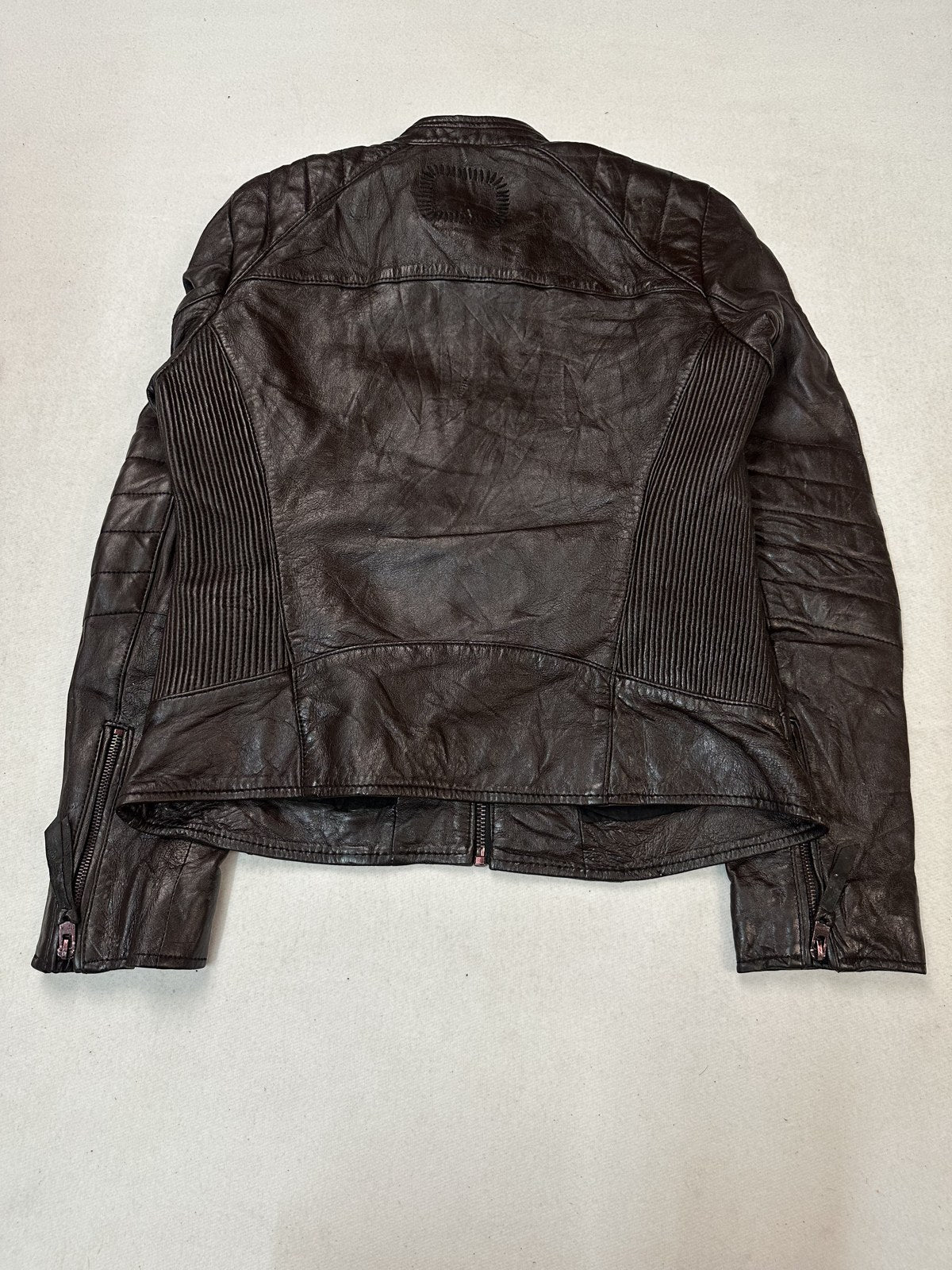 Rear view of the size S burgundy biker jacket, quilting visible across the shoulder yoke