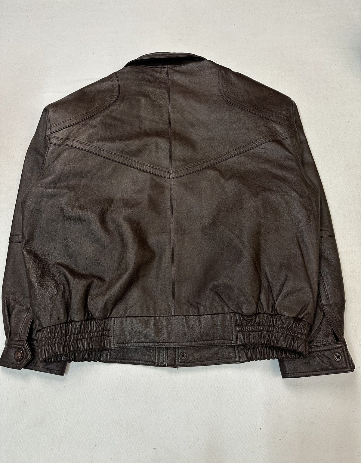Back of the burgundy XXL bomber jacket showing the shoulder yoke and straight hem