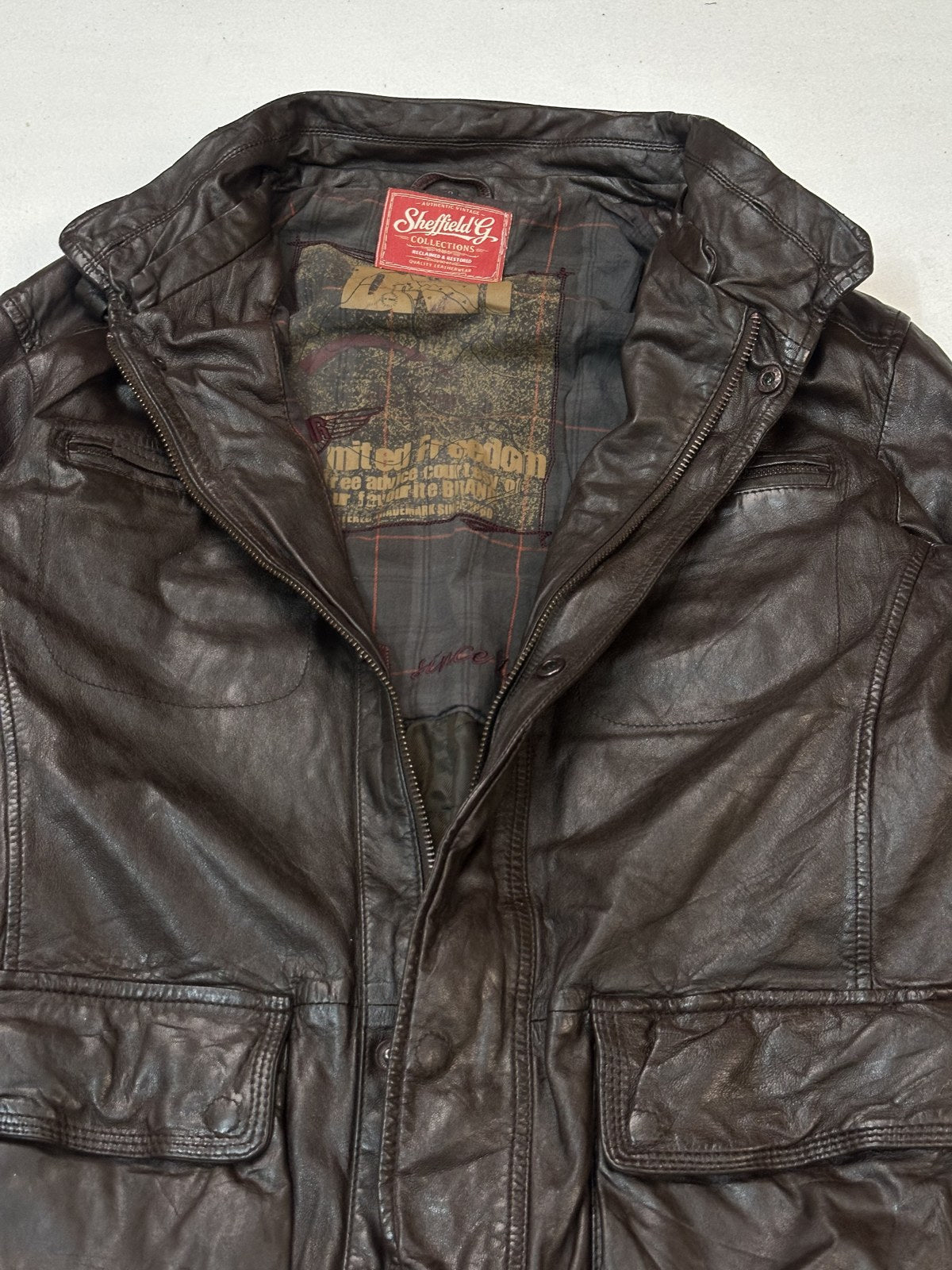 Inside lining of the size XL burgundy leather utility bomber jacket