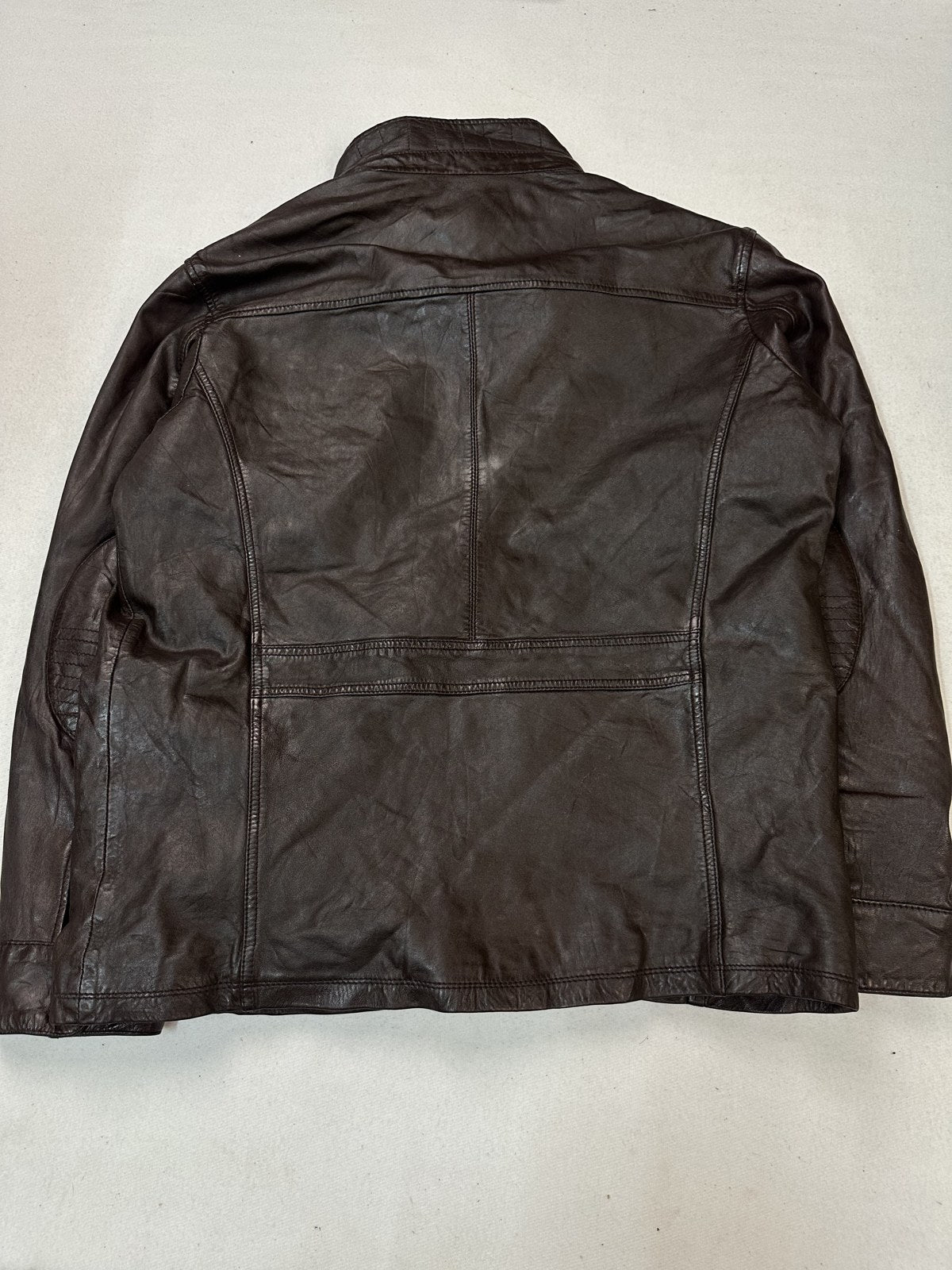 Rear view of the XL burgundy bomber jacket showing its longer body length