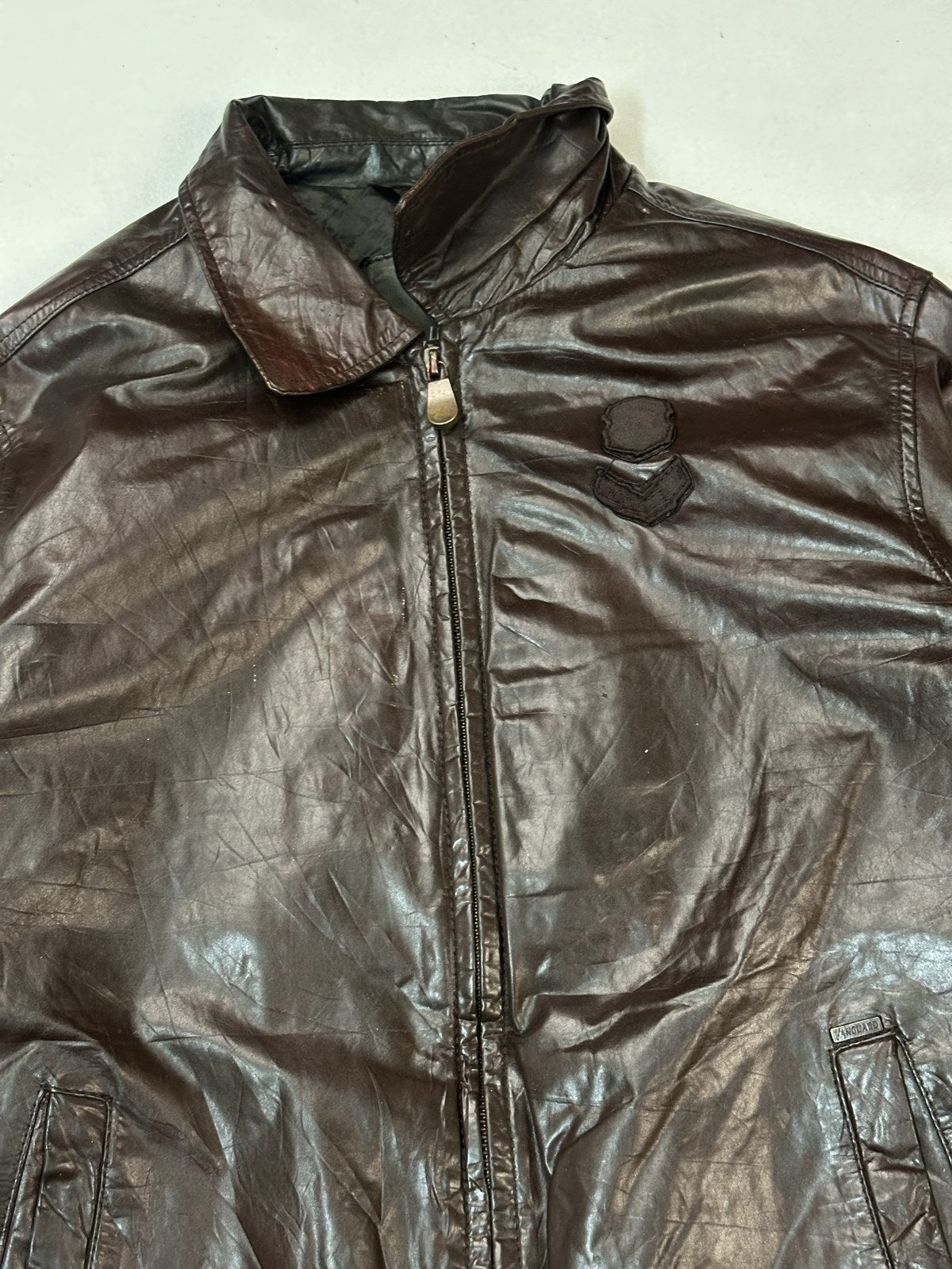 Detail of the ribbed hem and the grain of the burgundy leather