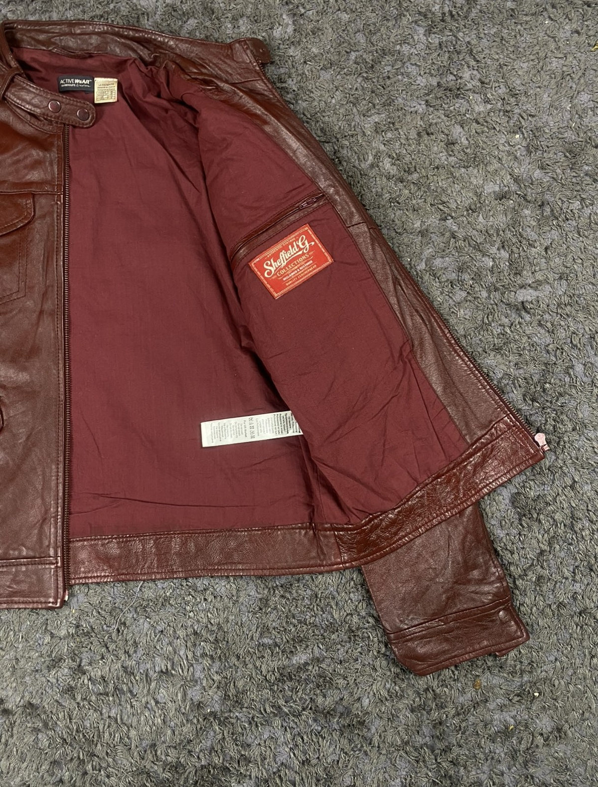 Inside lining of the size M burgundy leather bomber jacket
