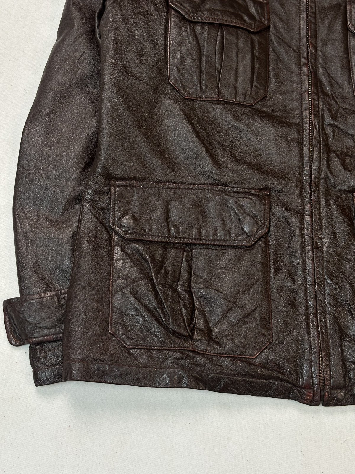 Soft shirt collar of the burgundy bomber jacket seen from above the shoulders