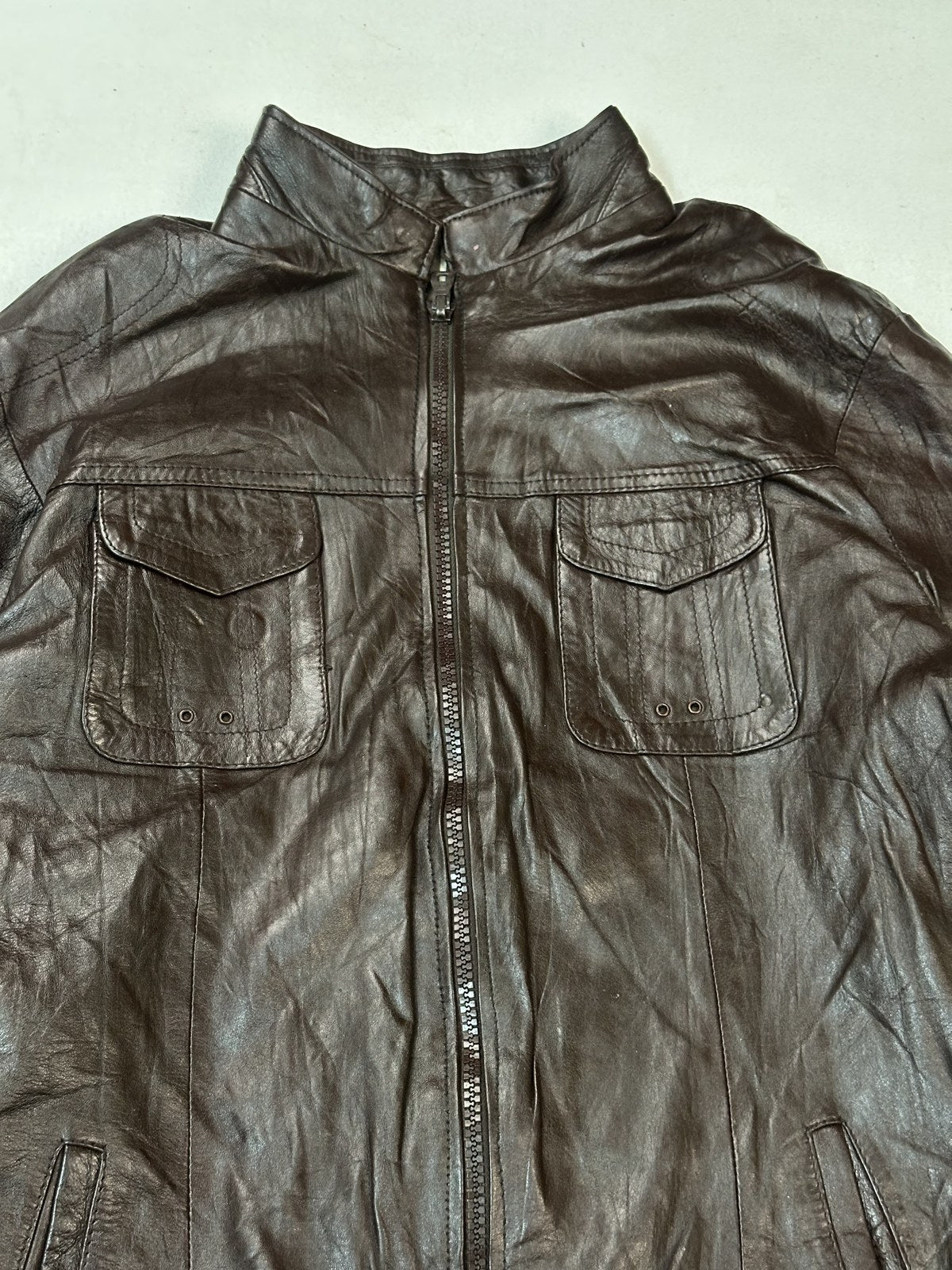 Surface detail of the burgundy leather and the hem stitching on the size XL bomber