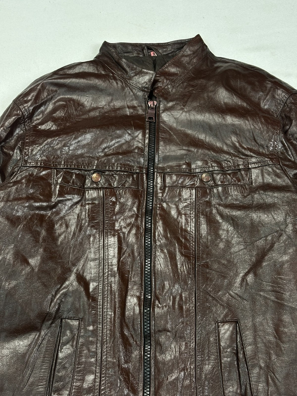 Back of the panelled burgundy bomber jacket, showing the shoulder seams