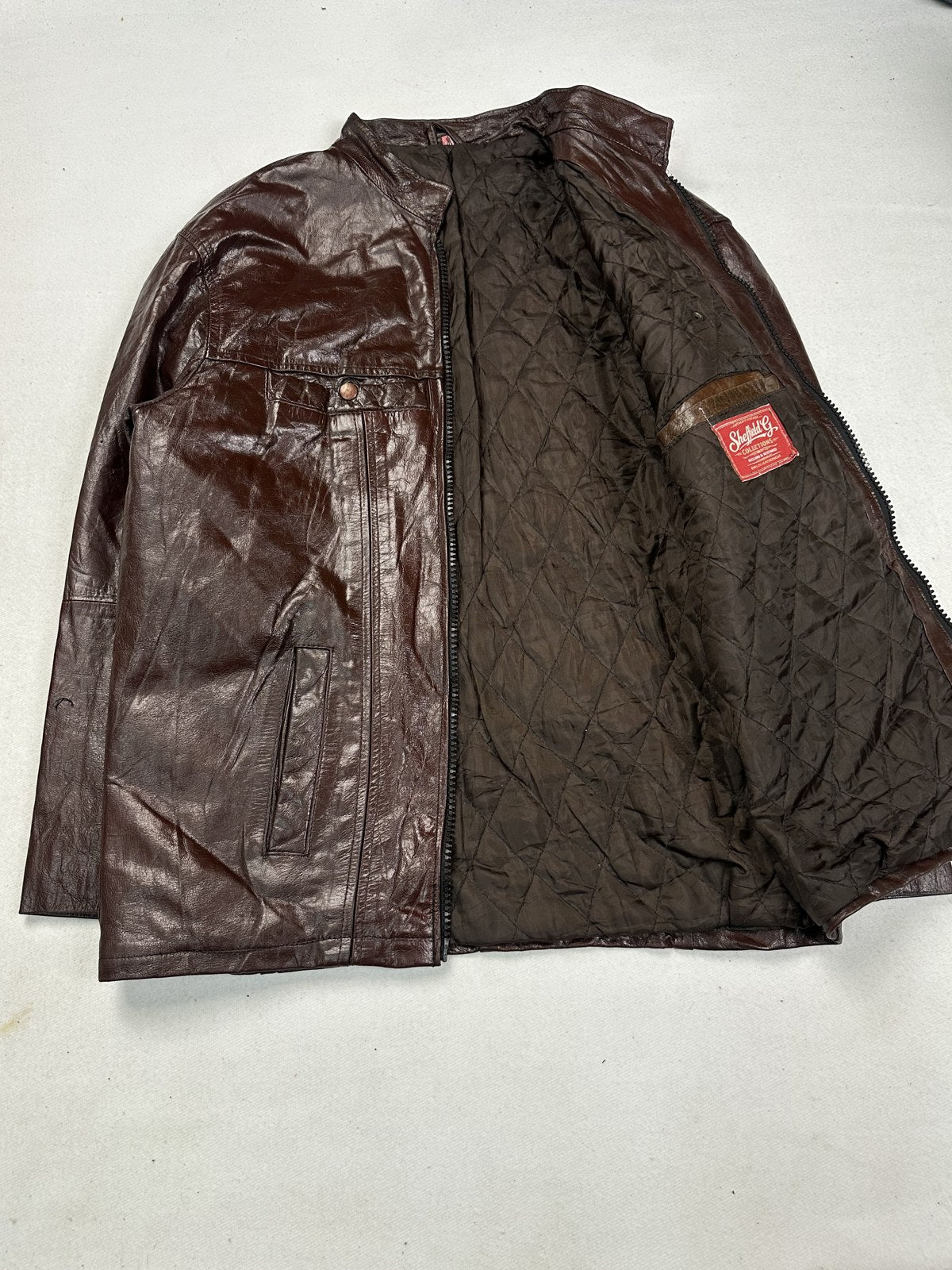 Quilted lining inside the panelled burgundy leather bomber jacket