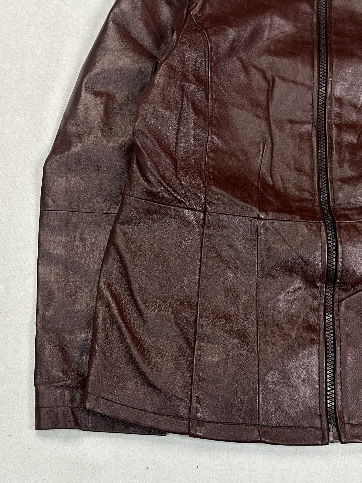 Stand collar and zip pull on the soft shoulder burgundy bomber jacket