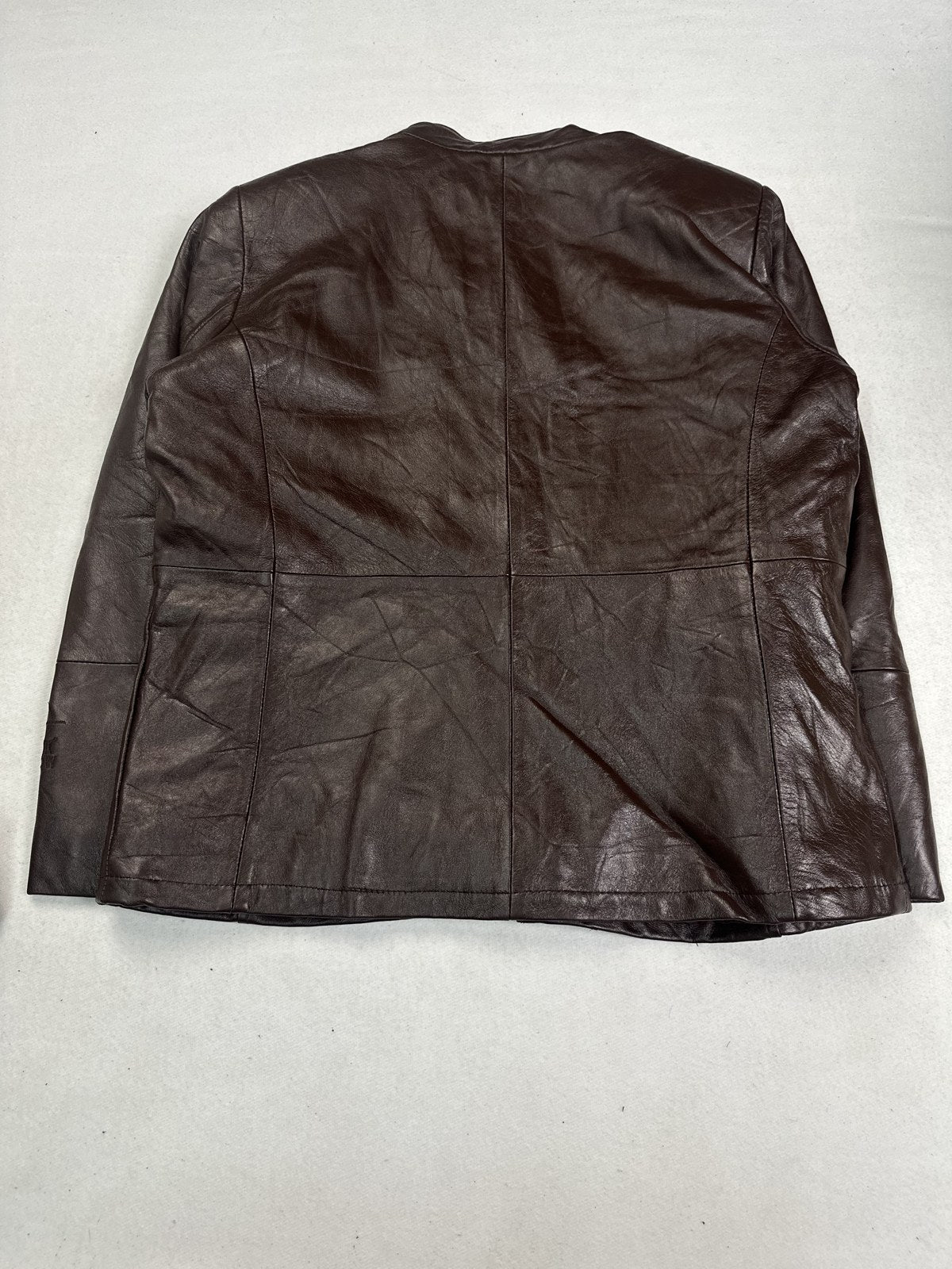 Rear view of the XL burgundy bomber jacket showing the straight hem