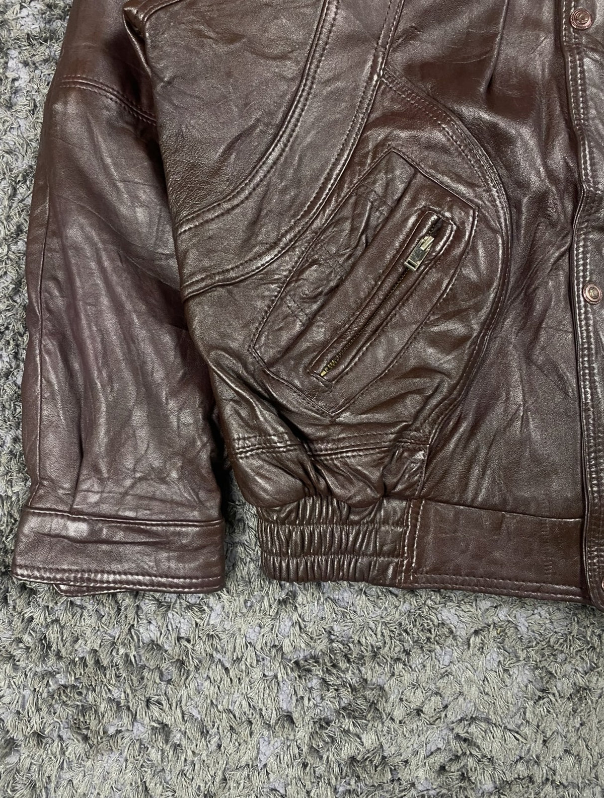 Ribbed cuff and hem detail on the burgundy bomber jacket in XXL
