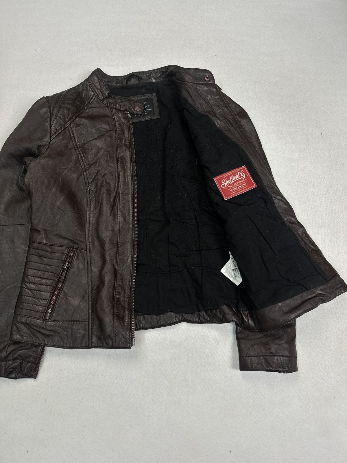 Cafe racer opened out to show the lining inside the pintucked body