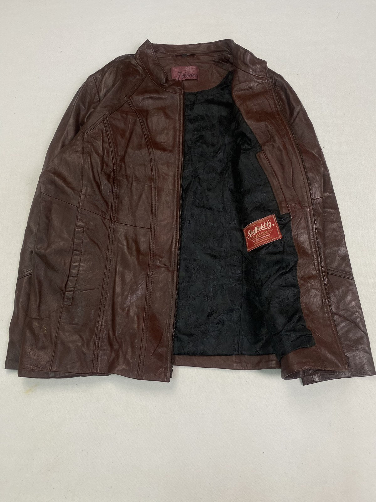 Cafe racer opened out to show the black quilted lining inside
