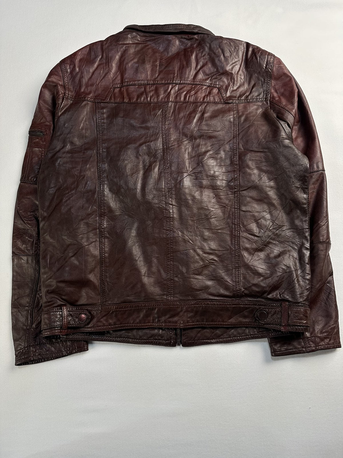 Back of the size L burgundy cafe racer shown flat