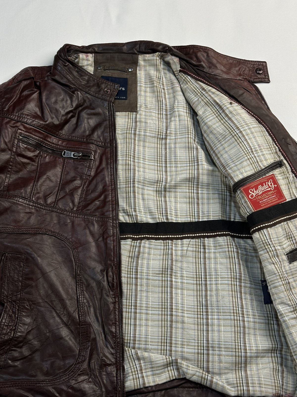 Cafe racer opened out to show the grey check lining inside