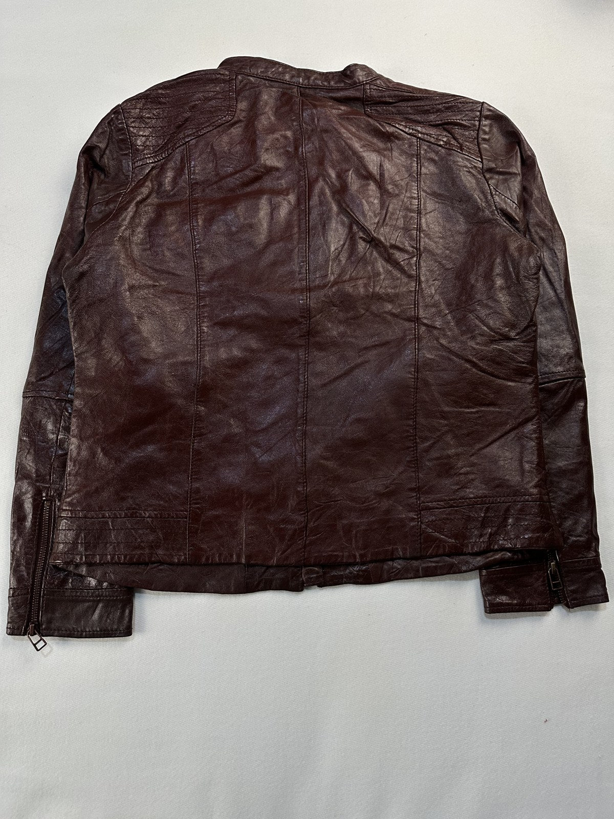 Back of the size S burgundy cafe racer shown flat