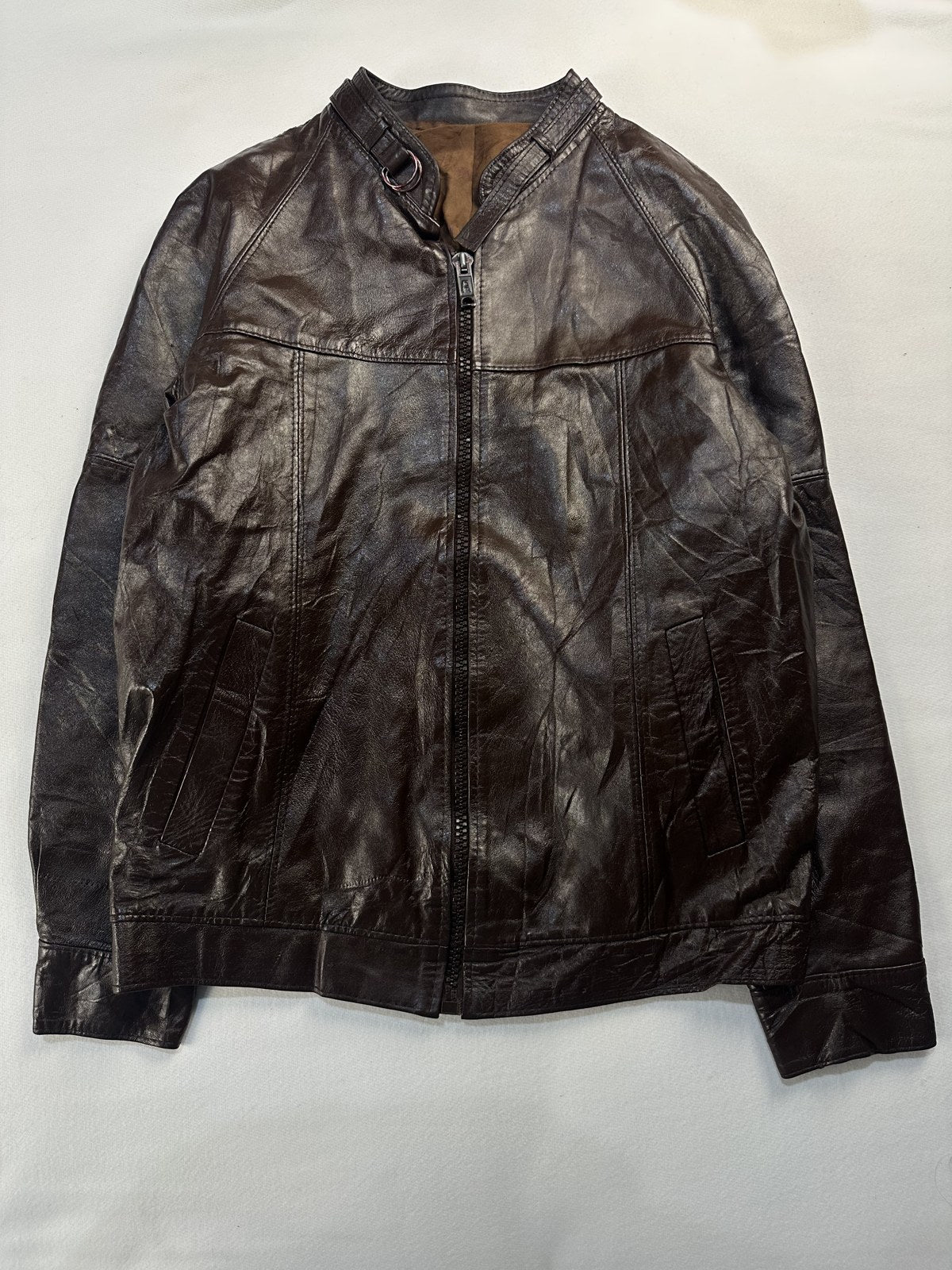 Burgundy leather cafe racer jacket in size L laid flat from the front
