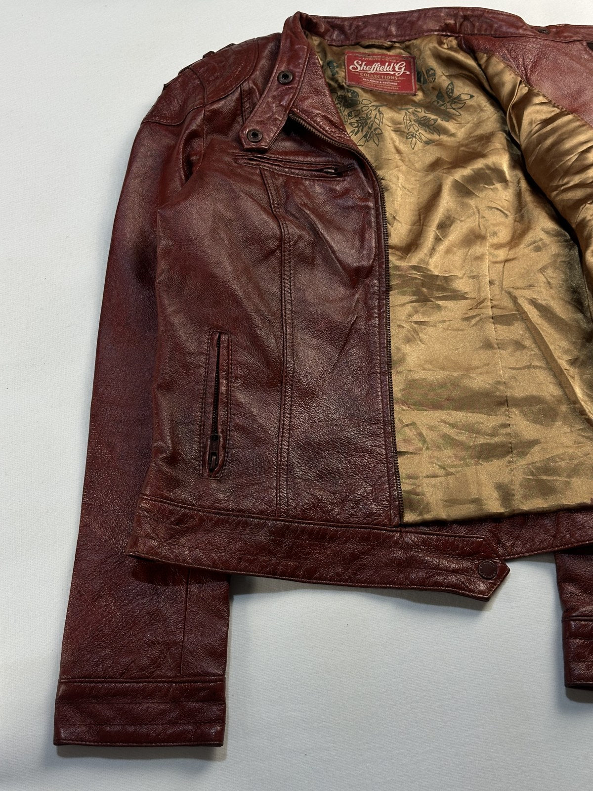 Cafe racer opened out to show the gold satin lining inside