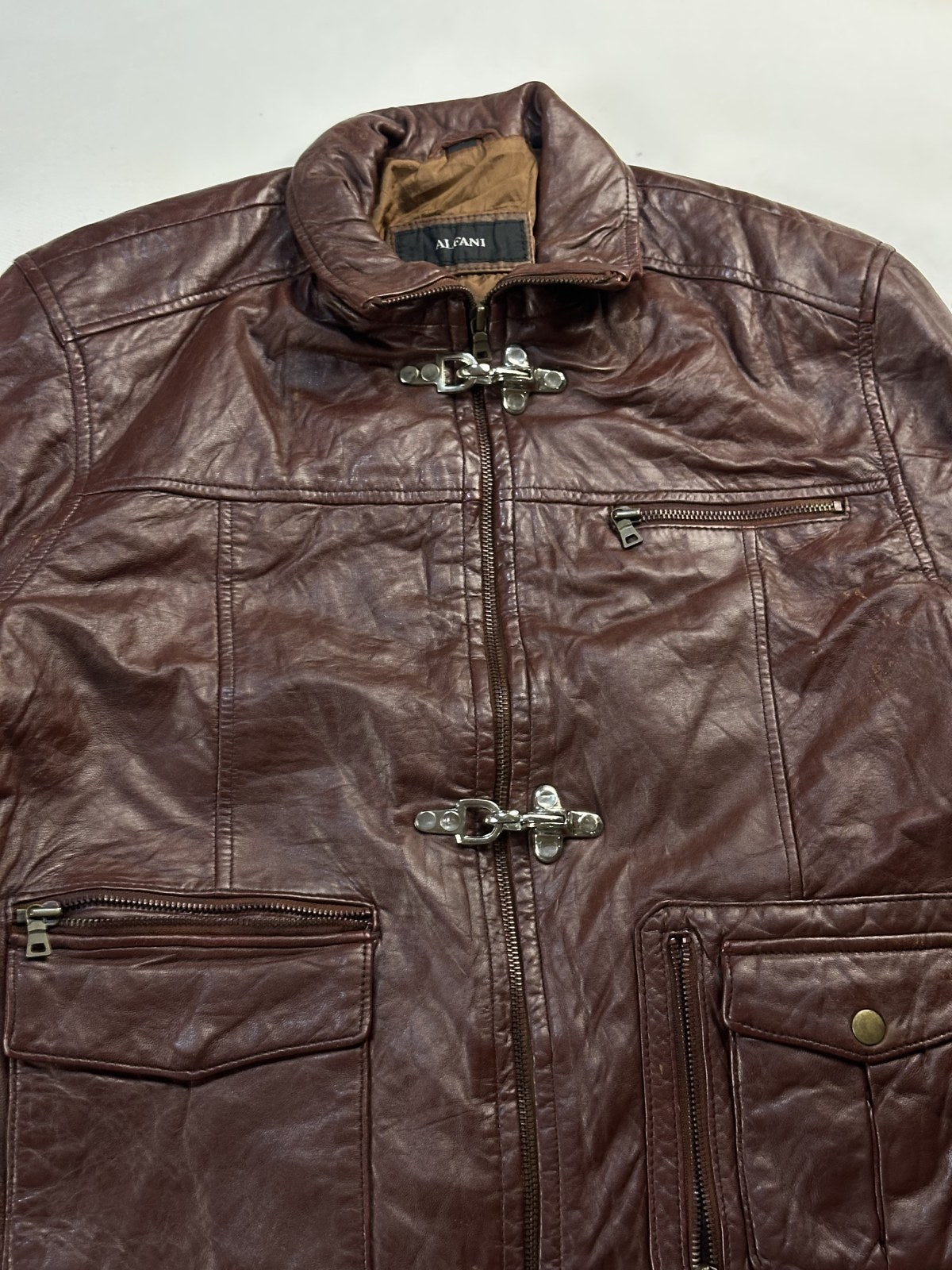 Collar and the triple clasp front of the burgundy field jacket