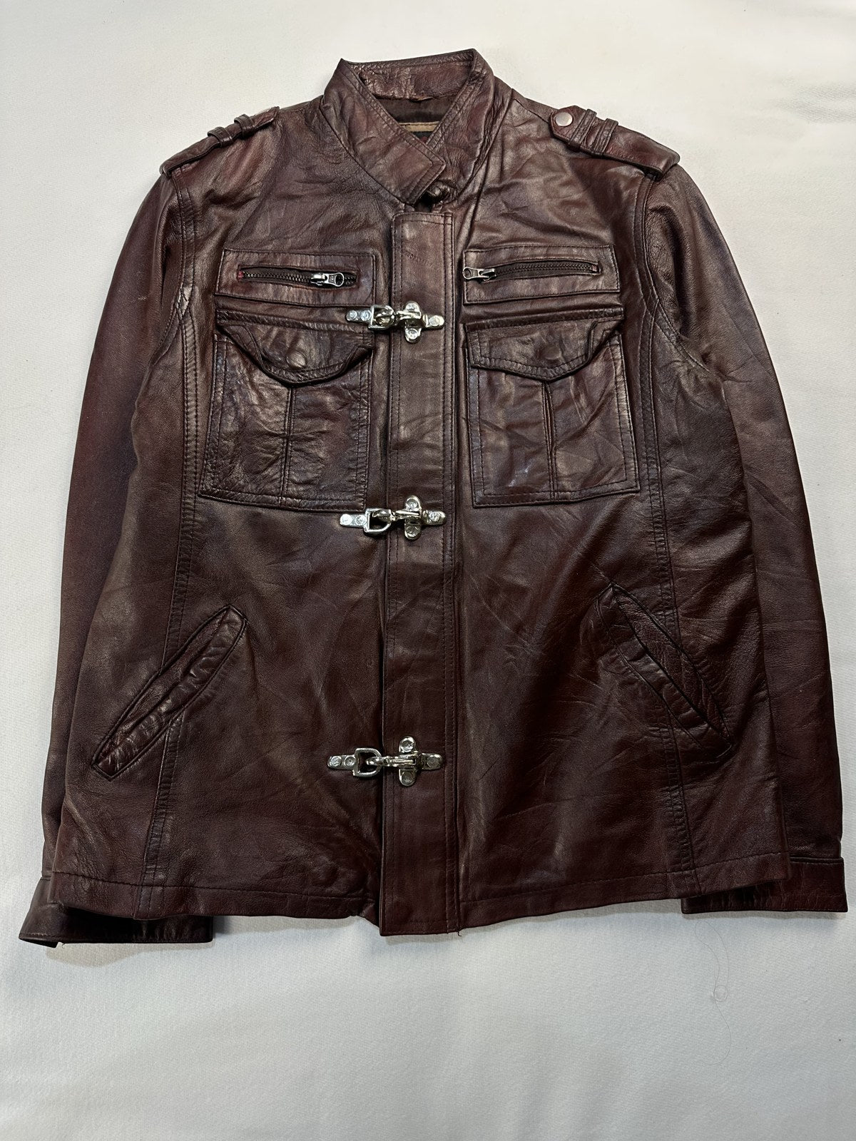Burgundy leather field jacket in size M laid flat from the front