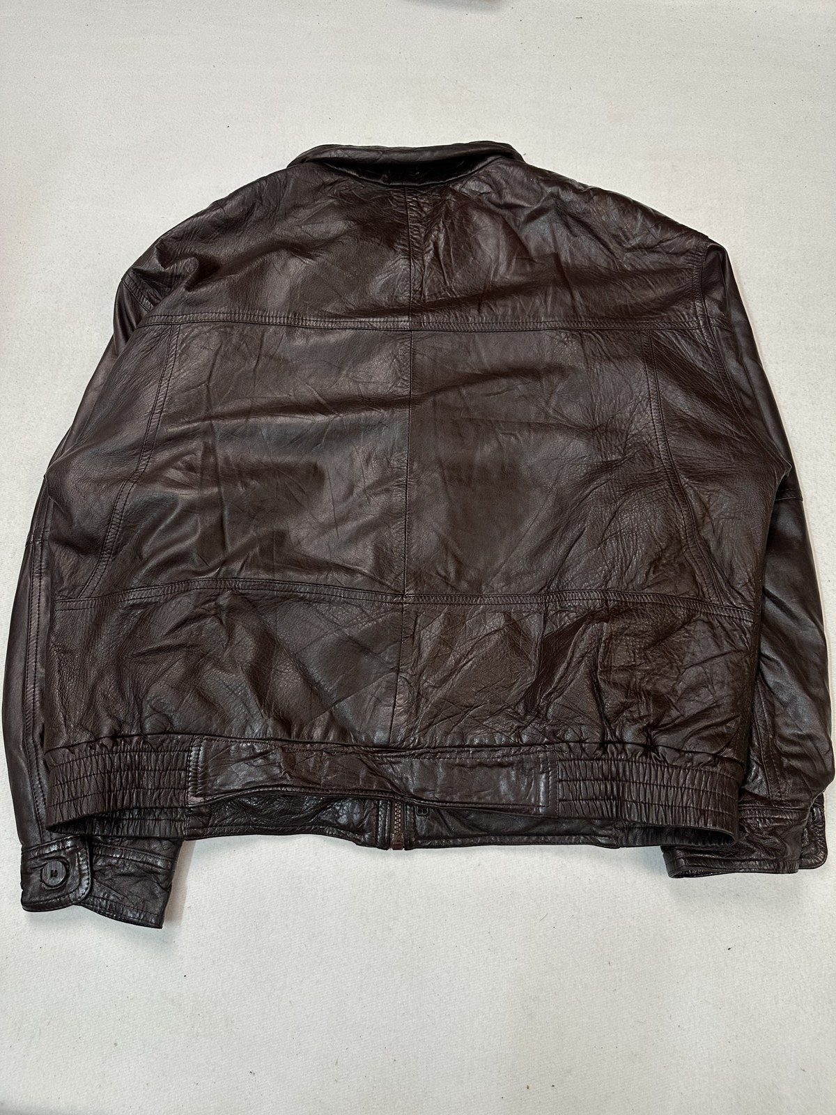 Back of the XXL burgundy flight jacket, showing the width across the shoulders and the rib at the hem