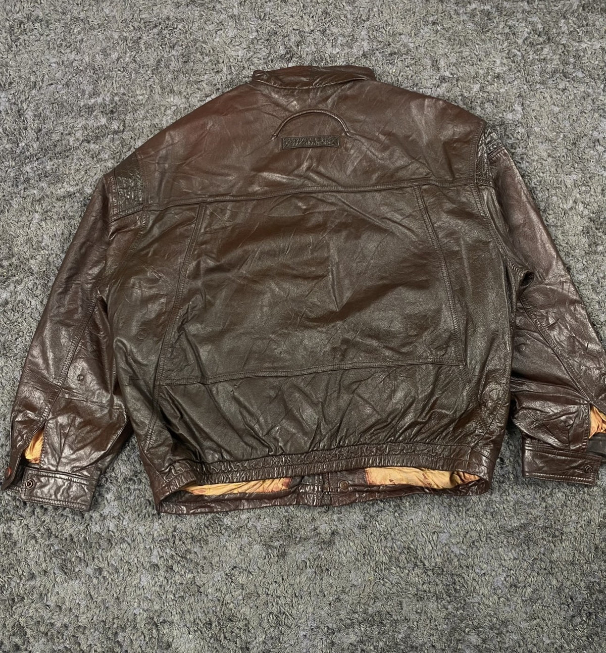 Back panel of the XXL burgundy flight jacket laid flat