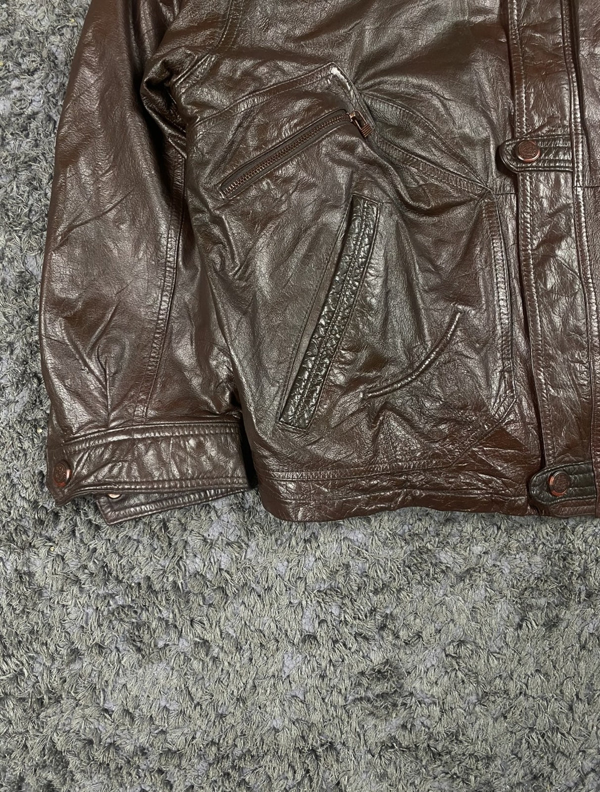 Rib hem and side seam detail on the XXL burgundy leather jacket