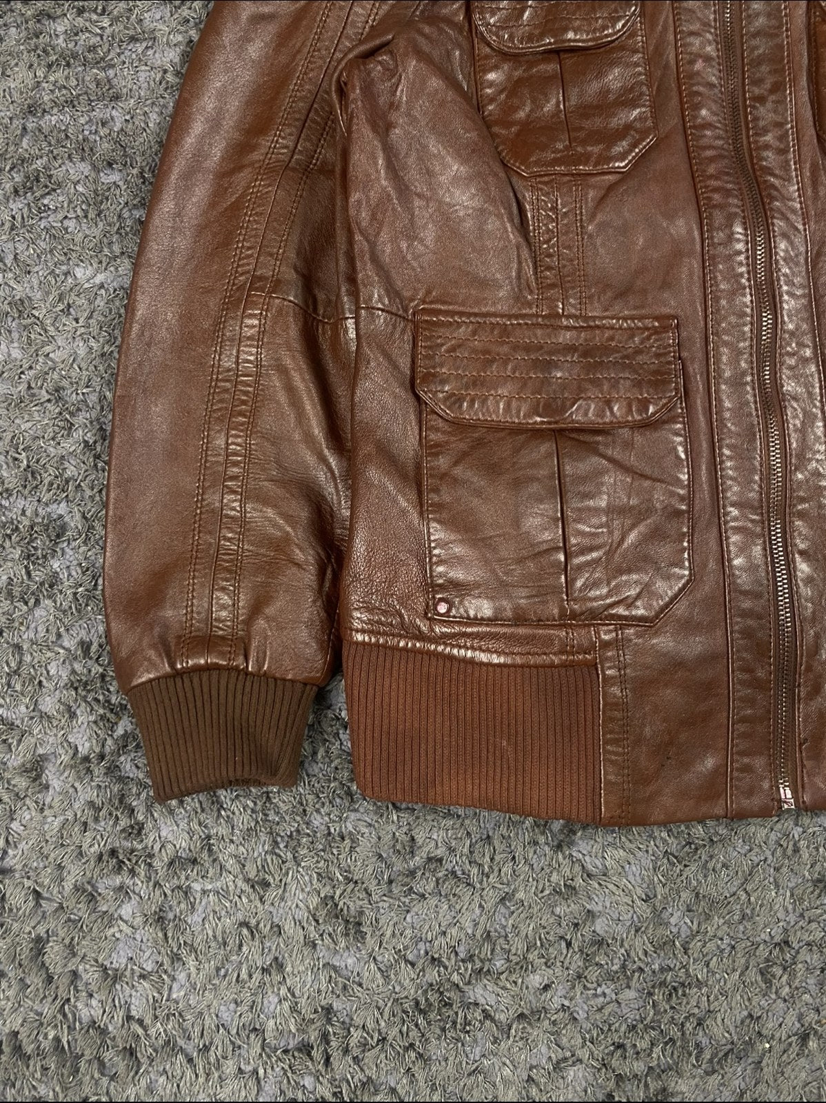 Collar and upper zip of the four patch pocket burgundy flight jacket
