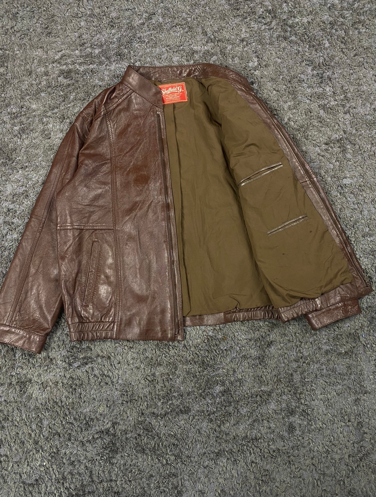 The size XL brown cafe racer, 27 inches long through the body